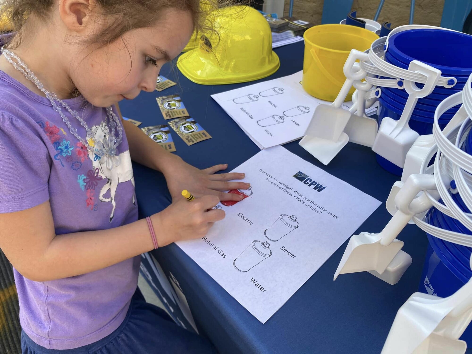 child coloring at the "Get the Scoop on 811" event