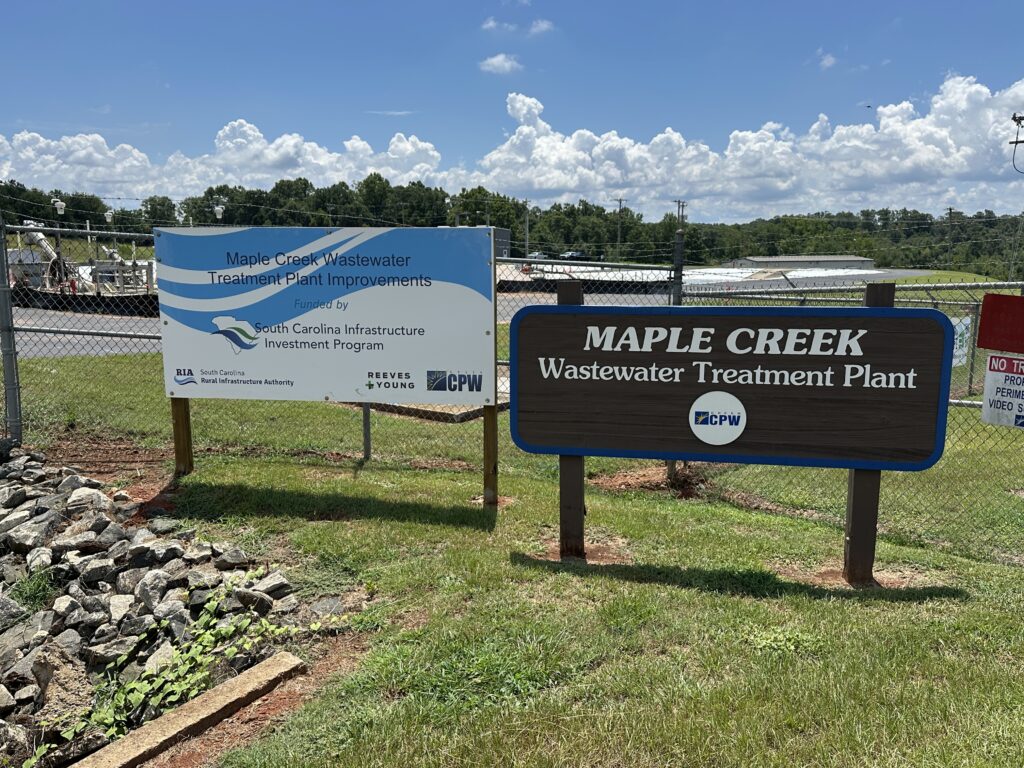 Photo of the signs at Maple Creek Wastewater Treatment related to the plant expansion and Rural Infrastructure Authority grant.