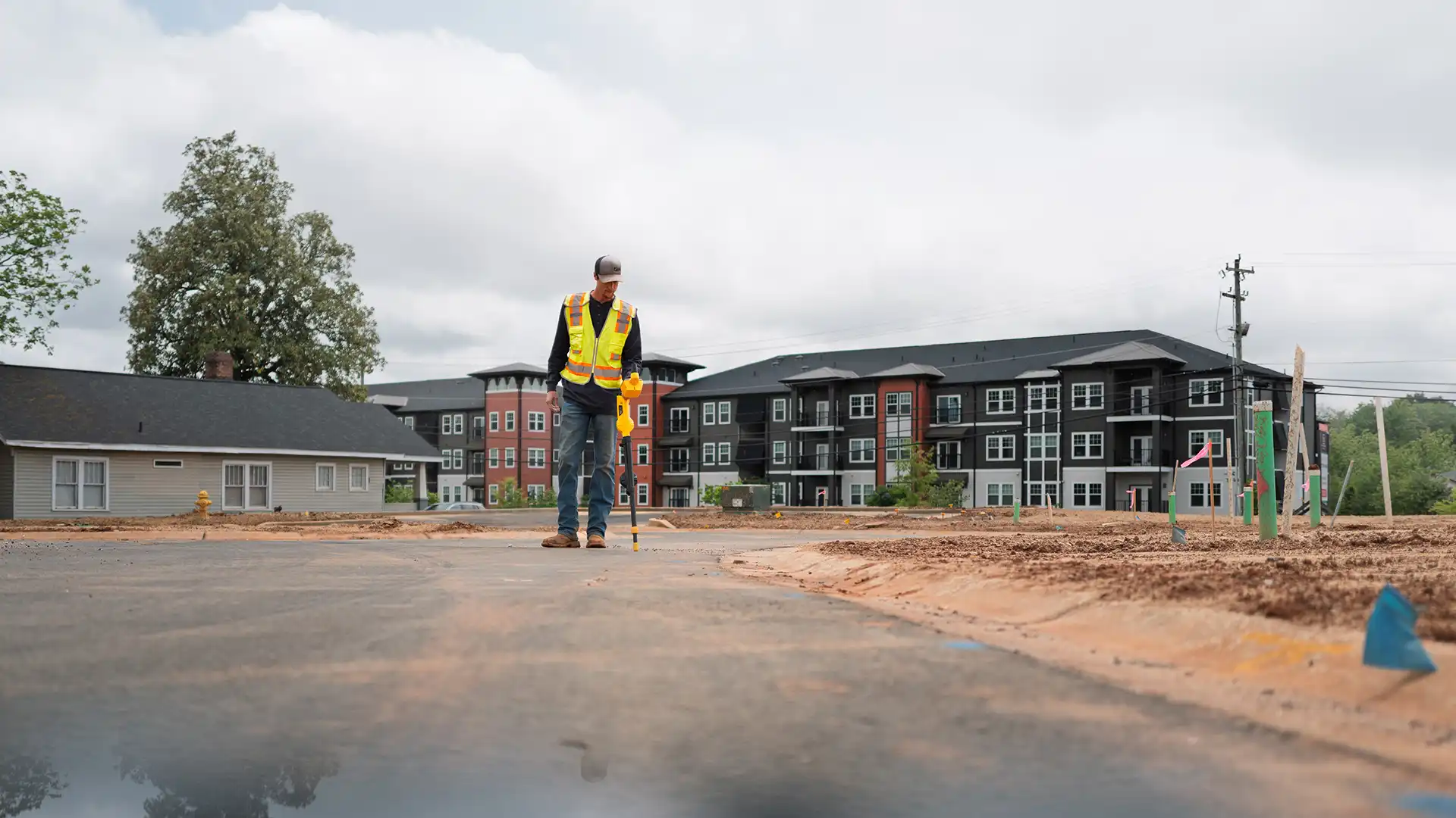employee checking utility at a new apartment construction site2